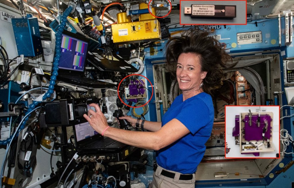 In this image, we showcase NASA astronaut Katherine Megan McArthur aboard the International Space Station (ISS). Highlighted in a red circle at the top of the image is our MiniPIX TimePIX Radiation Monitoring Camera, a key tool designed to safeguard the astronauts and the sensitive electronic and computer systems onboard. Adjacent to the MiniPIX, you will spot a golden device; this is the original, comparatively larger, and less efficient radiation monitor of the ISS. Centre stage, circled in red, stands the robust HERA Radiation Monitor - a product of NASA's ingenuity, equipped with ADVACAM's Single-photon counting chip. Image courtesy of NASA